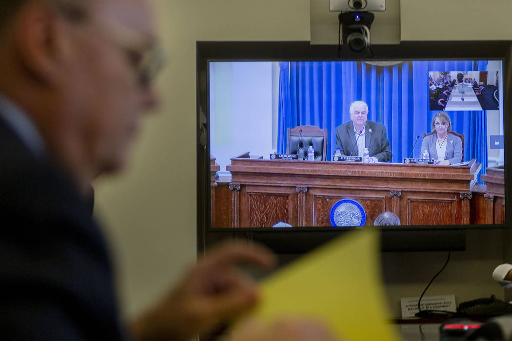 Nevada Gov. Steve Sisolak, left, and Lt. Gov. Kate Marshall joins the video conference for an a ...