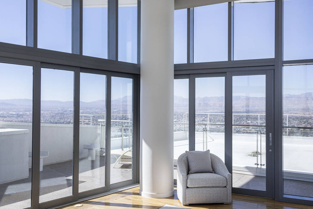Windows overlooking the Las Vegas Valley in the master bedroom in a Palms Place penthouse under ...
