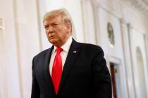 President Donald Trump walks into the East Room of the White House to speak about his judicial ...