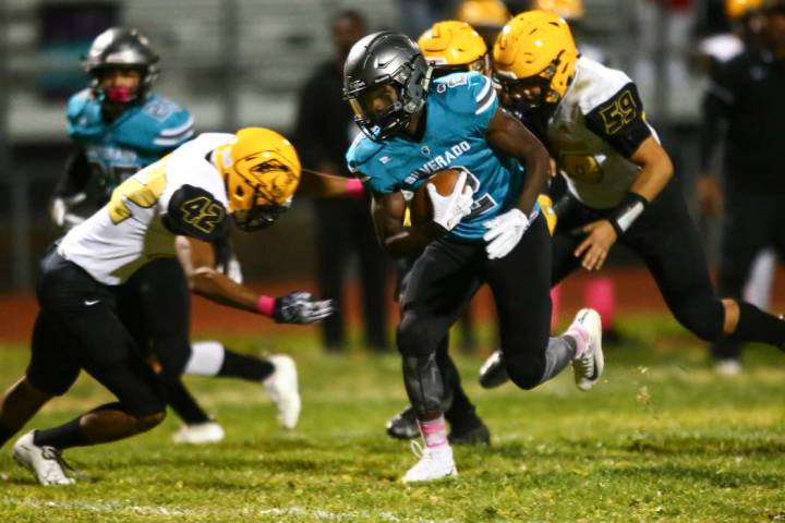 Silverado's Aginae Cunningham (2) runs the ball against Clark during the first half of a footba ...