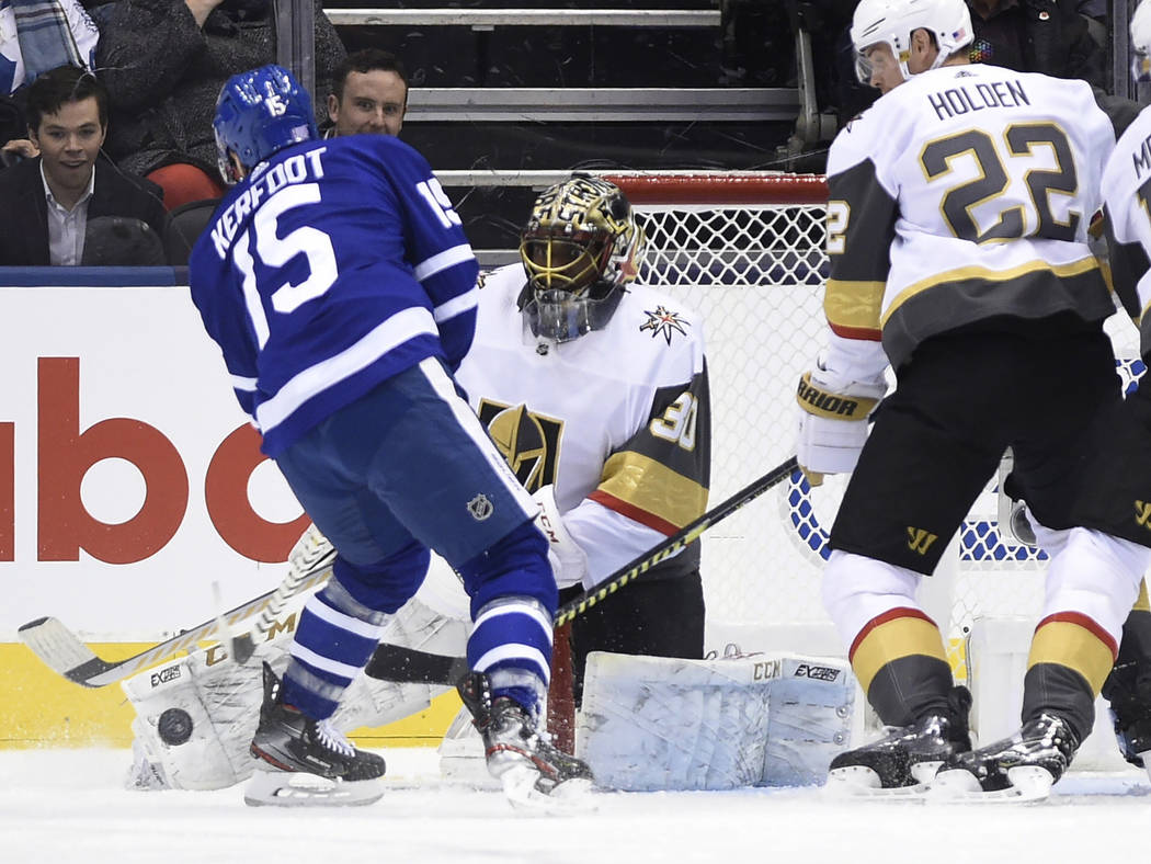 Vegas Golden Knights goaltender Malcolm Subban (30) makes a save on Toronto Maple Leafs center ...
