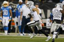 Oakland Raiders free safety Erik Harris (25) runs after intercepting a pass against the Los Ang ...