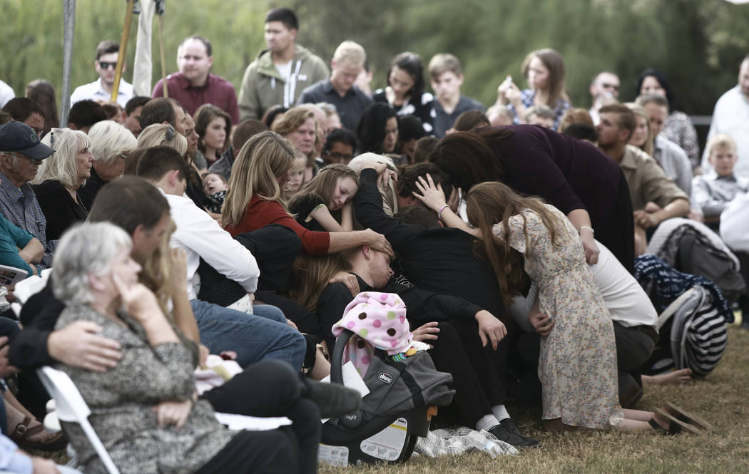 People attend the funeral of Dawna Ray Langford, 43, and her sons Trevor, 11, and Rogan, 2, who ...