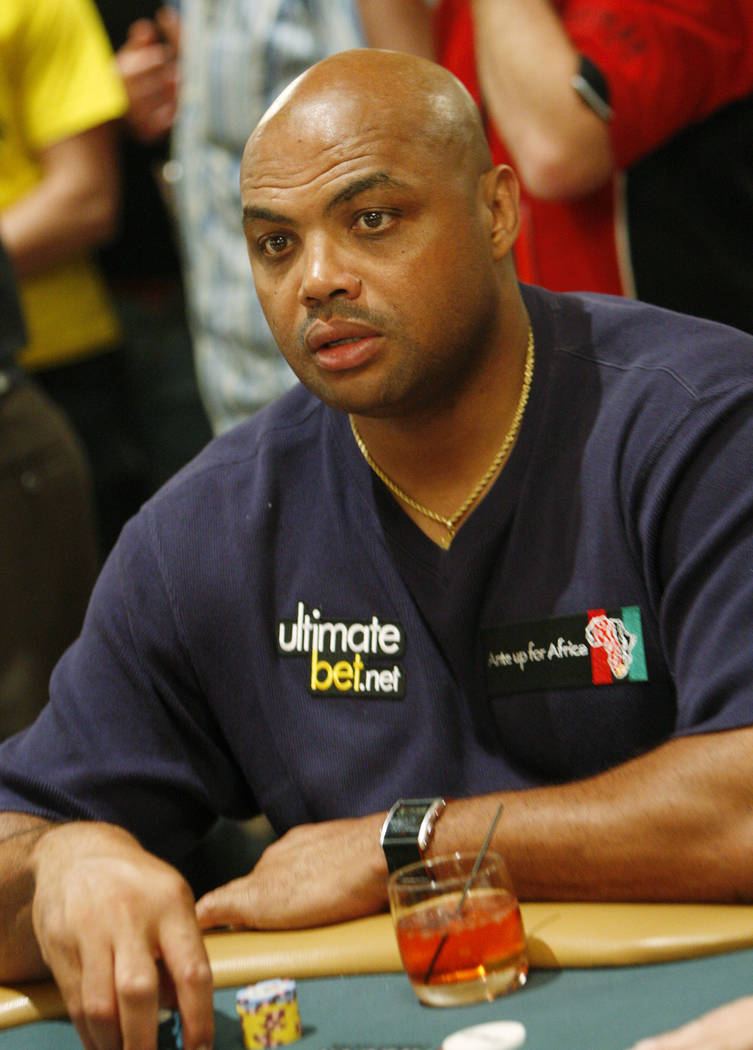 Charles Barkley plays in the Ante Up For Africa charity poker tournament during the World Serie ...