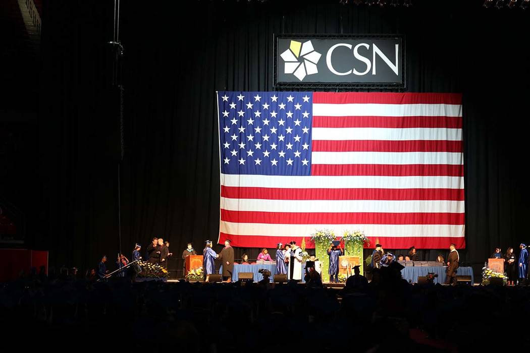 Students wait for their names to be called at the College of Southern Nevada's 46th commencemen ...