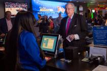 Former Las Vegas Mayor Oscar Goodman places the first bet at the William Hill Race & Sports ...