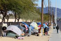 This Feb. 19, 2018, photo shows people camp on Las Vegas Boulevard North near Foremaster Lane. ...