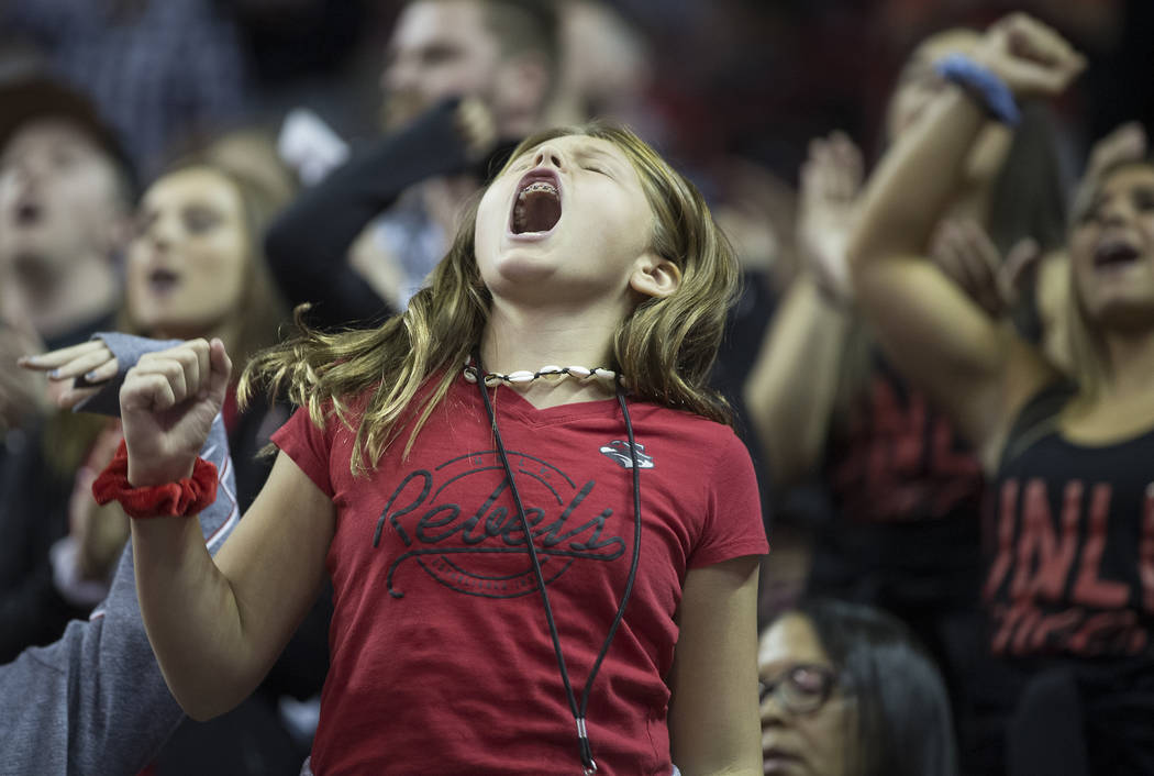 UNLV fans cheer for the Rebels during their NCAA basketball game with Kansas State in the secon ...