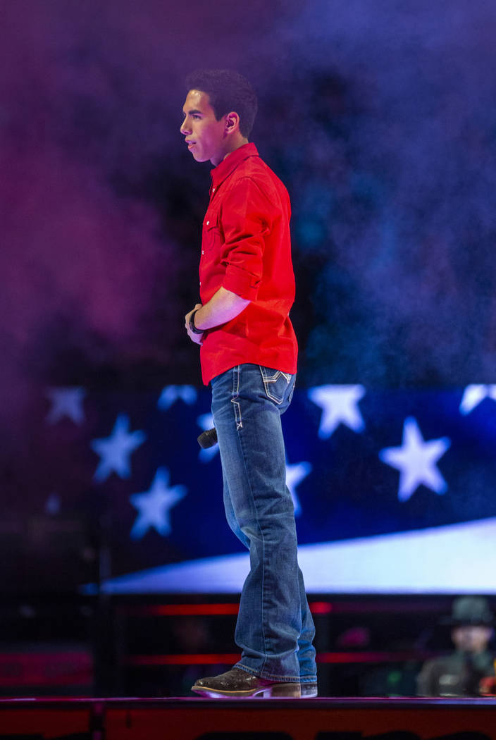 Antonio Moraes sings the National Anthem during the third day of the PBR World Finals at T-Mobi ...