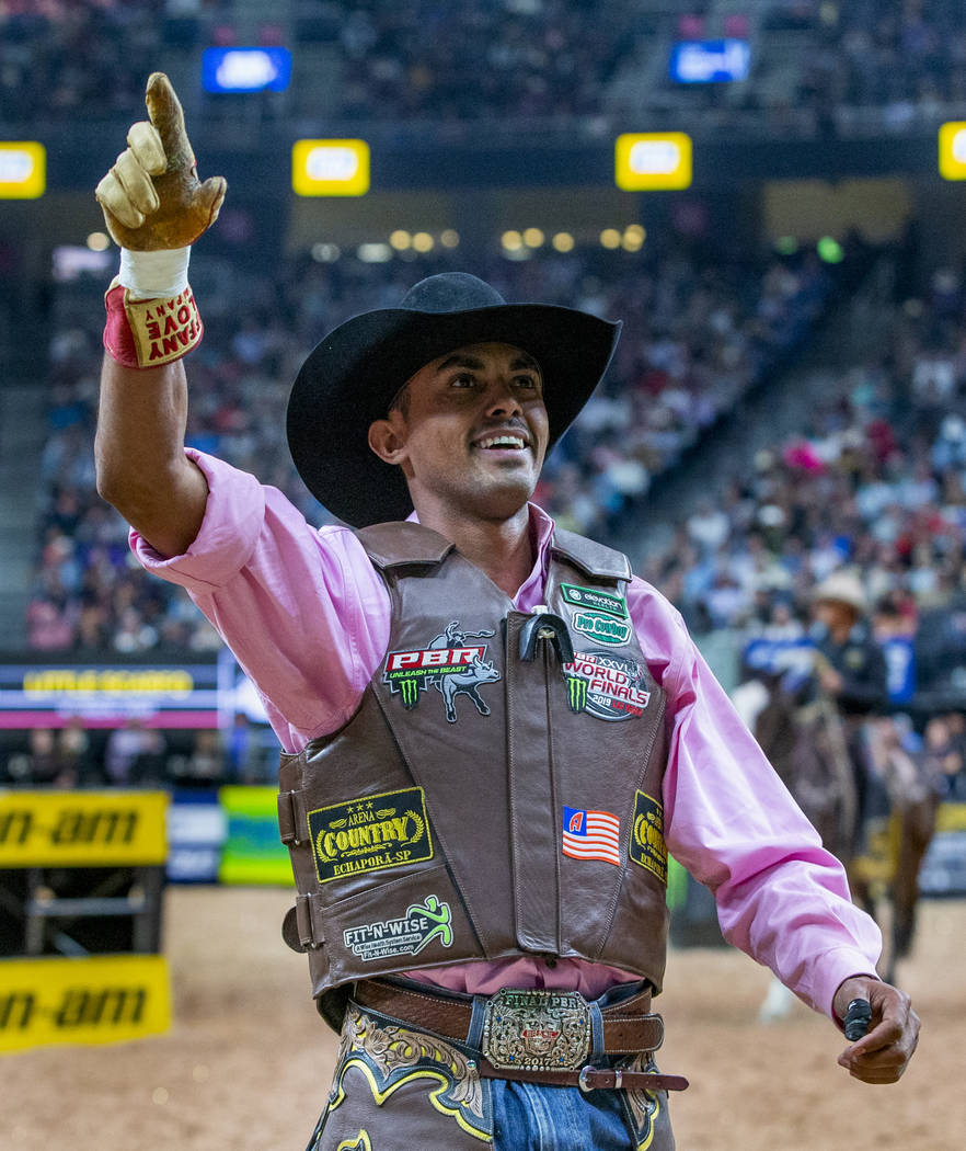 Lucas Davino celebrates a successful ride atop Little Scarfo during the third day of the PBR Wo ...