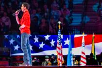 Antonio Moraes sings the National Anthem during the third day of the PBR World Finals at T-Mobi ...