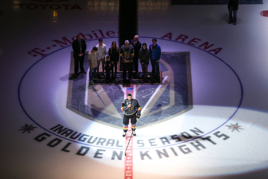 Vegas Golden Knights defenseman Deryk Engelland (5), center, speaks during a ceremony honoring ...