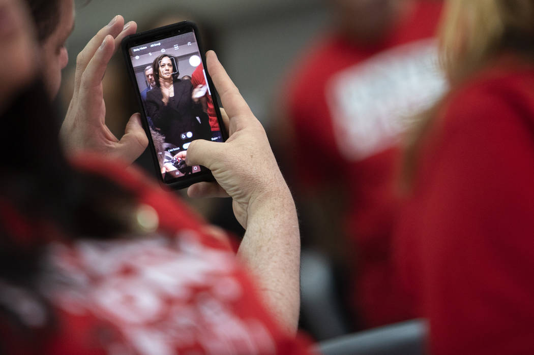 Presidential candidate and California Sen. Kamala Harris is seen through a union member's phone ...