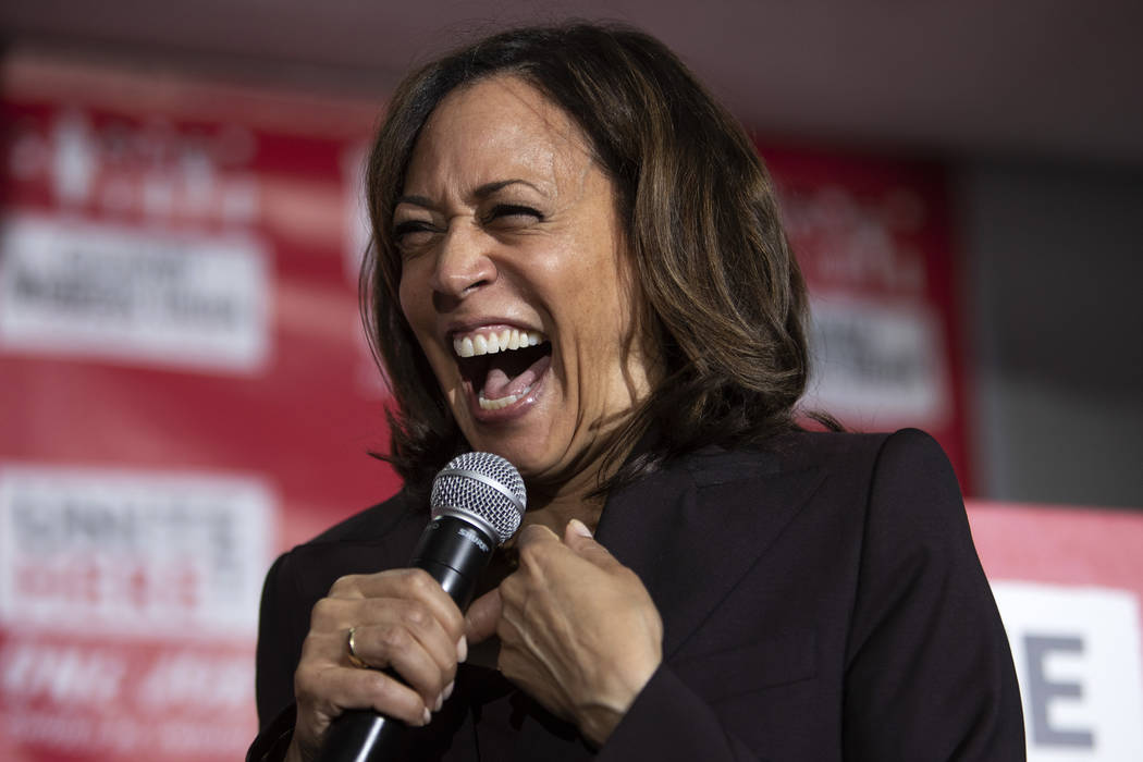 Presidential candidate Kamala Harris laughs while speaking to the crowd