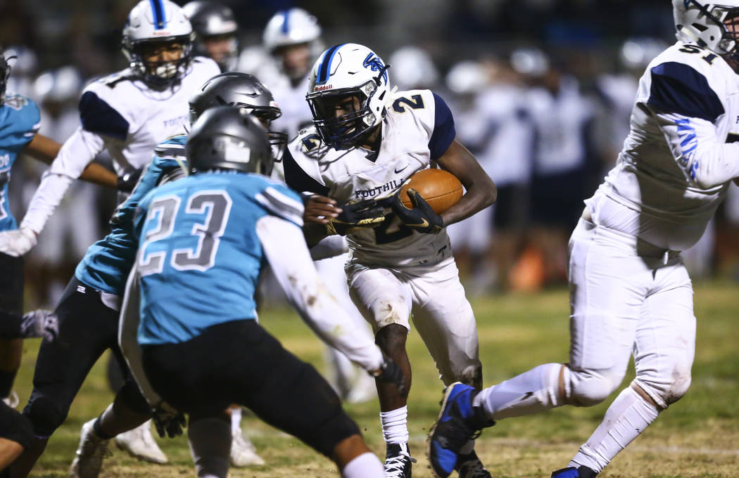 Foothill's Kendric Thomas (2) runs the ball during the second half of a 4A Desert Region footba ...