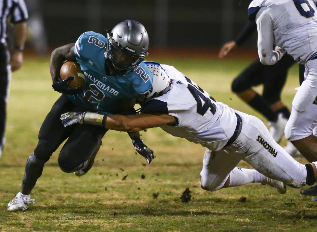 Foothill's Colter Mckee (45) stops Silverado's Aginae Cunningham (2) during the second half of ...