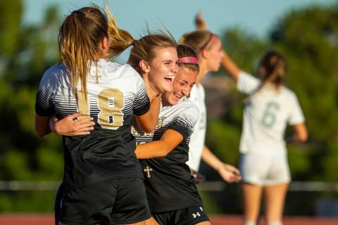Faith Lutheran's Amelia McManus (20, center) celebrates a goal with teammates Addy Radwanski (1 ...