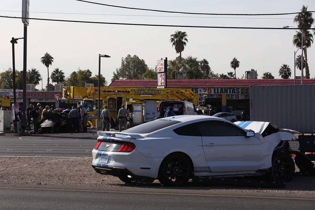 Las Vegas police investigate a two-vehicle crash that left two people dead early in the morning ...