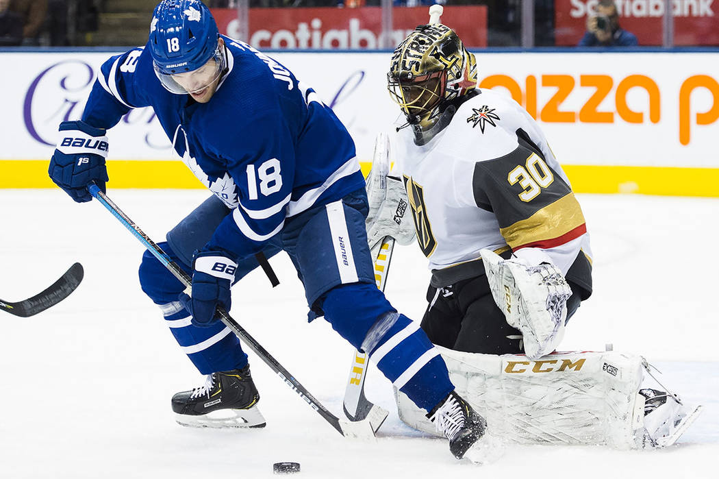Toronto Maple Leafs left wing Andreas Johnsson (18) gets stopped by Vegas Golden Knights goalte ...