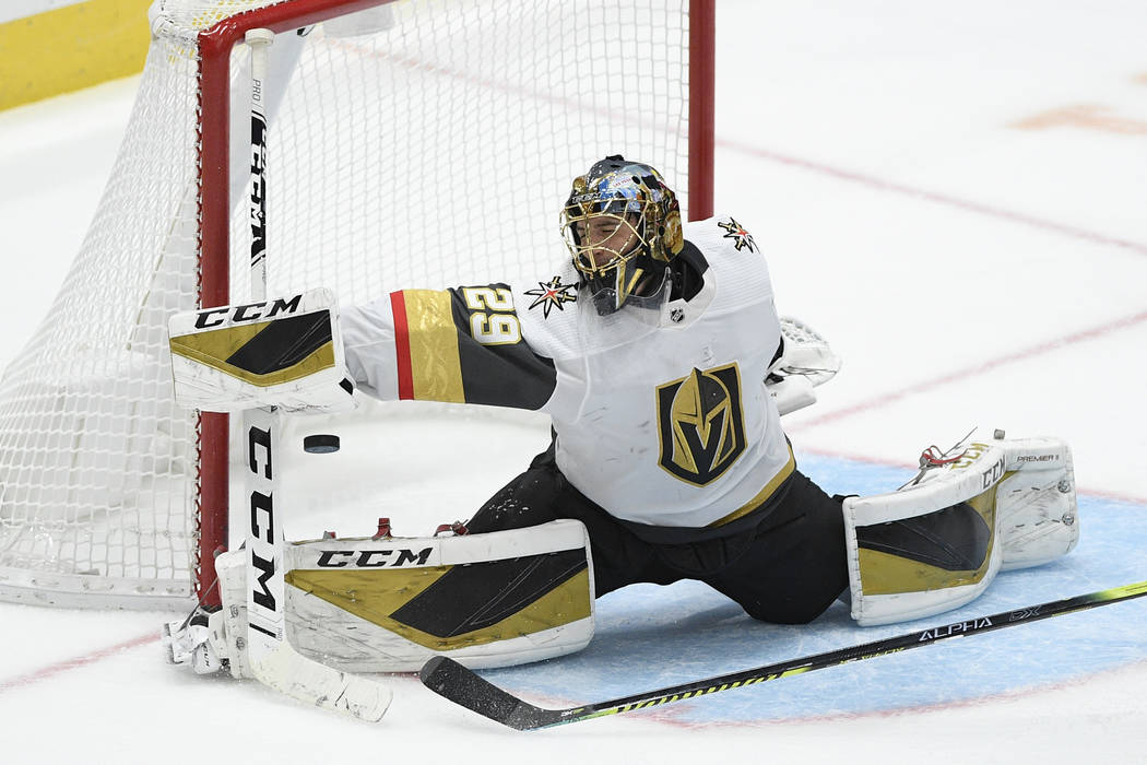 Vegas Golden Knights goaltender Marc-Andre Fleury reaches for the puck during the third period ...