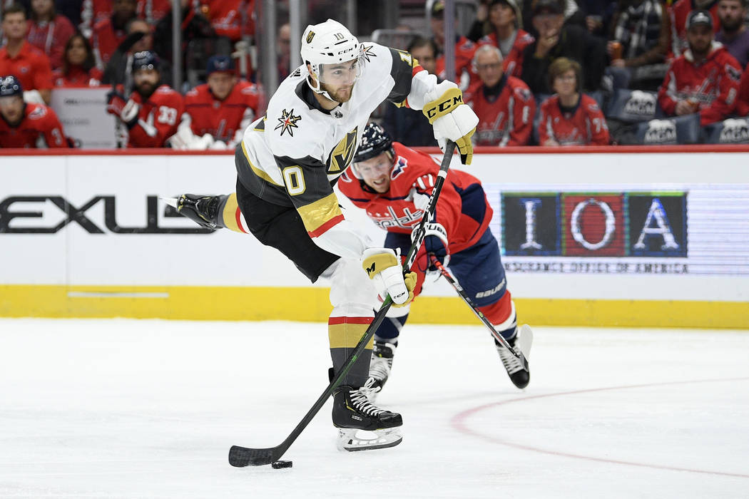 Vegas Golden Knights Nicolas Roy (10) winds up for a shot past Washington Capitals center Travi ...