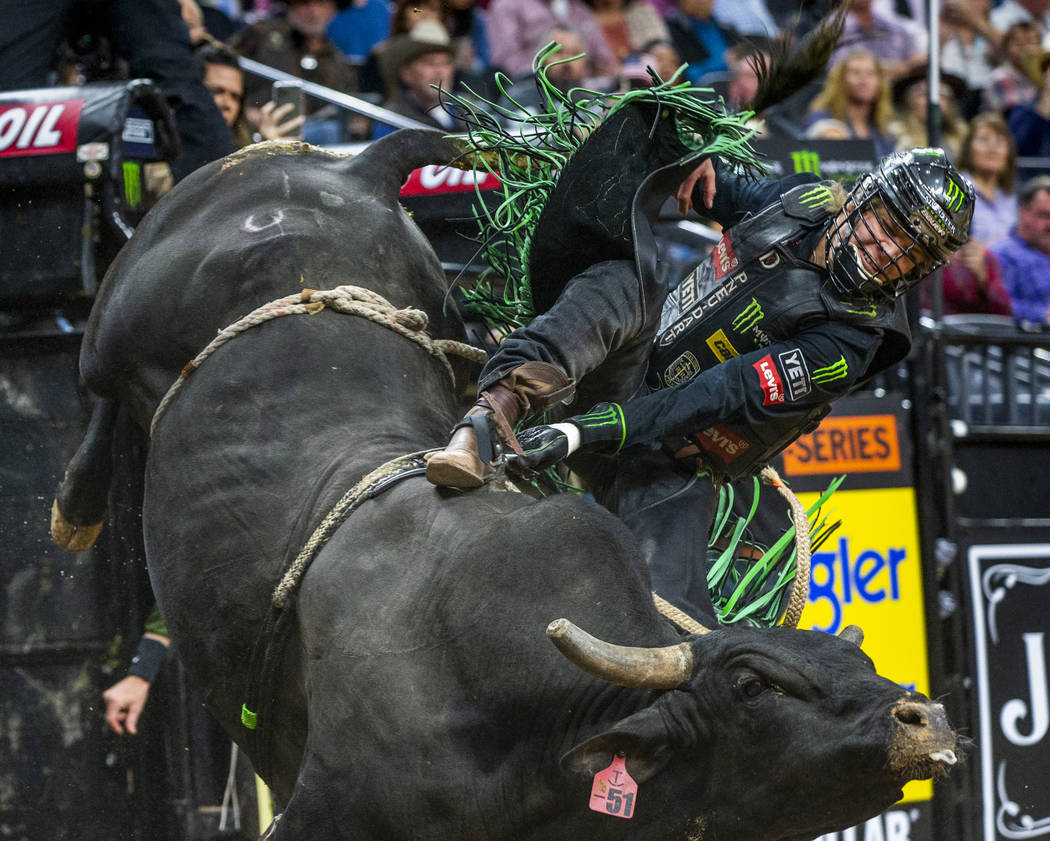 Derek Kolbaba gets sideways atop of Skeeter Peter during the fourth day of the PBR World Finals ...