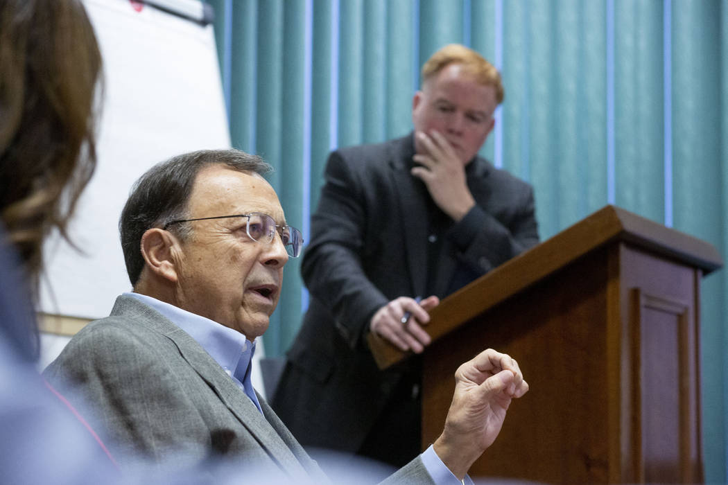 Former AD Jim Livengood, center, partakes in a panel led by lead sports columnist Ed Graney, ri ...