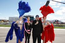 Grand marshals Kim Kardashian (2nd-L) and Caroll Shelby (2nd-R), with Las Vegas Showgirls, give ...