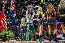 Jess Lockwood shows off his winning trophy after being awarded the 2019 PBR World Finals Champi ...