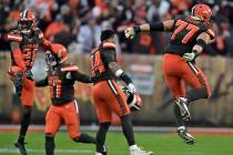 Cleveland Browns cornerback Denzel Ward (21) and teammates celebrate after they defeated the Bu ...