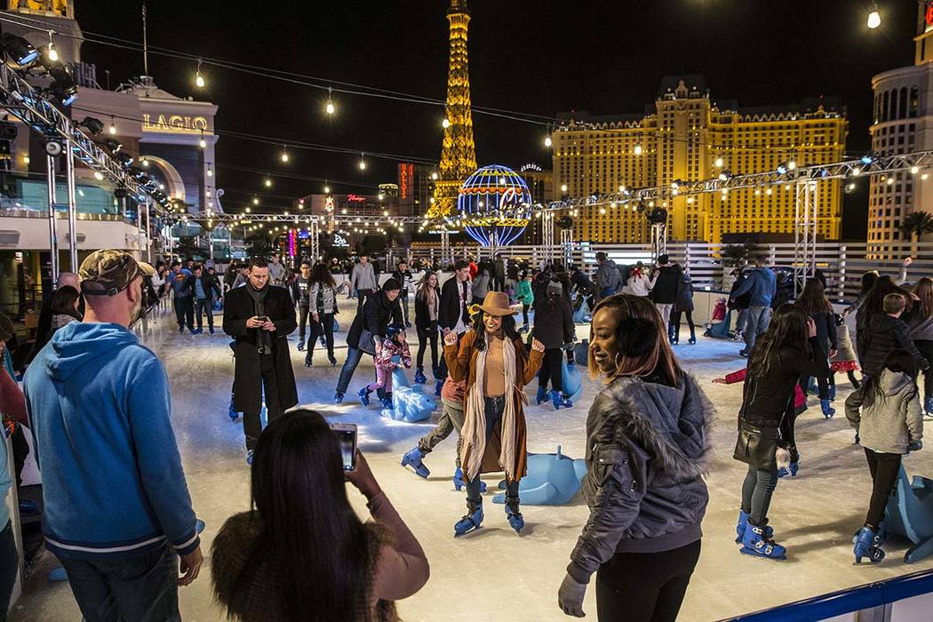 Skaters take advantage of a mild December day to enjoy The Cosmopolitan of Las Vegas Ice Rink o ...