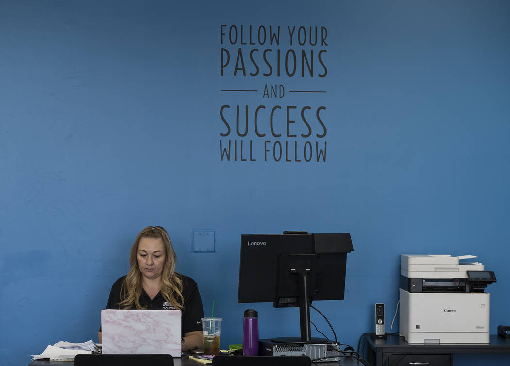 Michelle King, part-time registrar, works at her desk at Acceleration Academy in Las Vegas, Sun ...