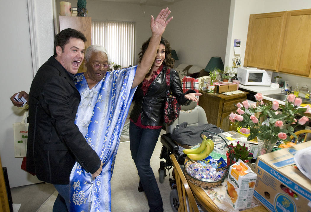 Donny Osmond does a dance move with Barbara Wilson, 74, as Marie looks on at Louise Shell Senio ...