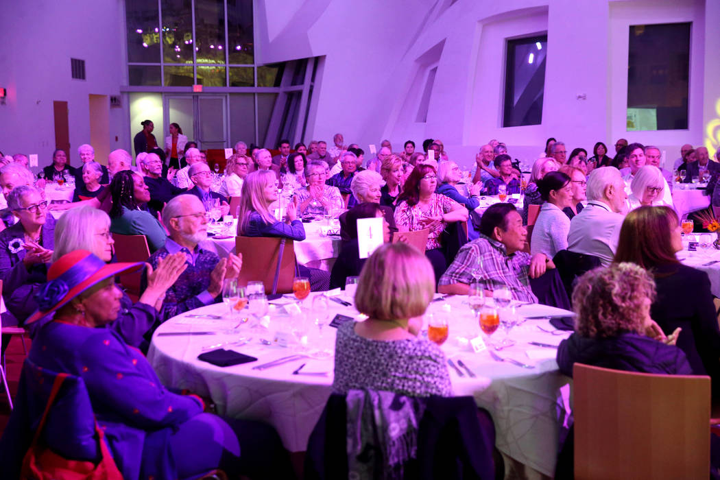 Guests applaud during Death Over Dinner - Alzheimer's Edition in the Keep Memory Alive Event Ce ...