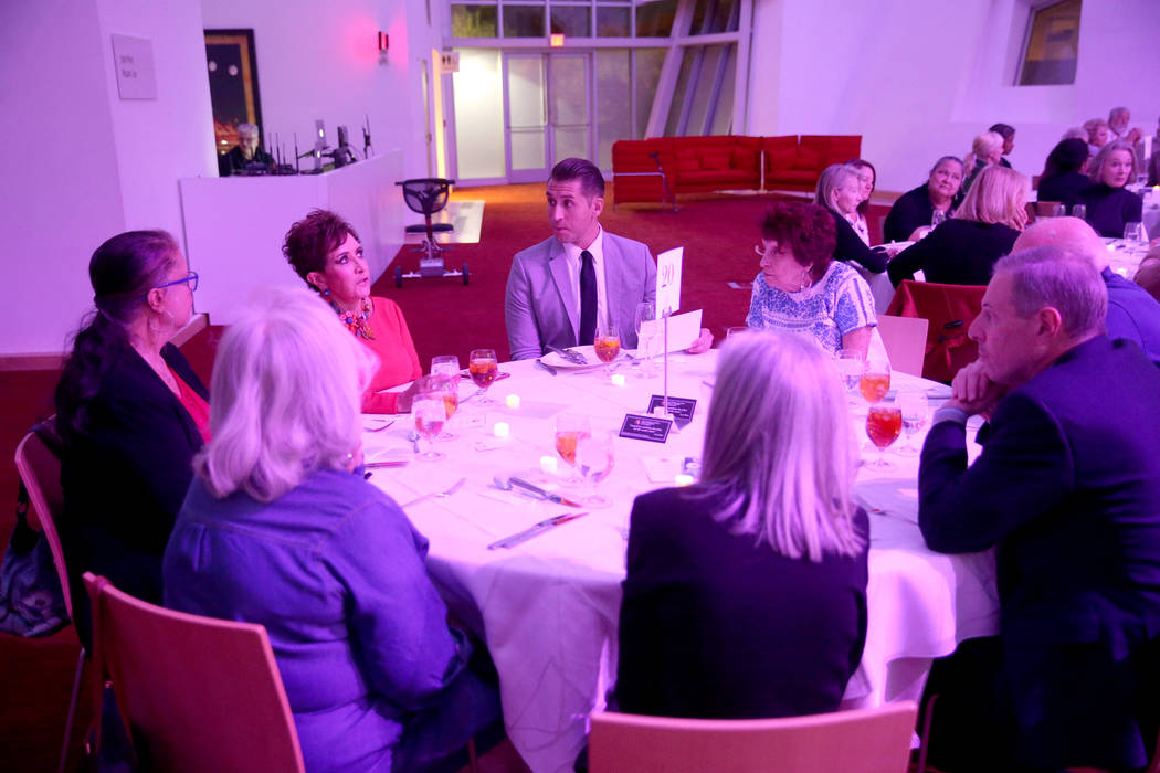 Guests talk during Death Over Dinner - Alzheimer's Edition in the Keep Memory Alive Event Cente ...