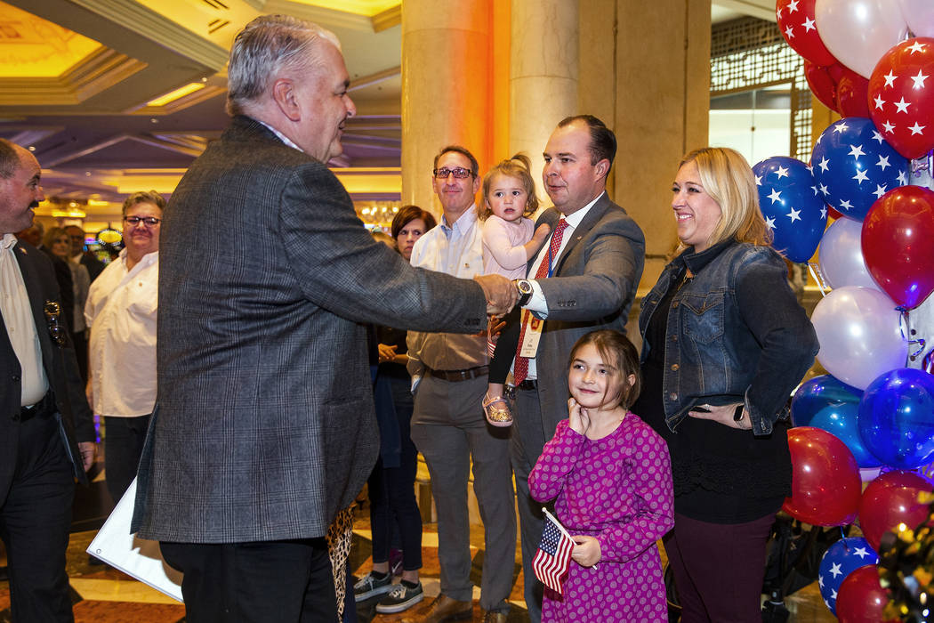 Gov. Steve Sisolak greets attendees as he arrives during a 'Salute Our Troops' ceremony honorin ...