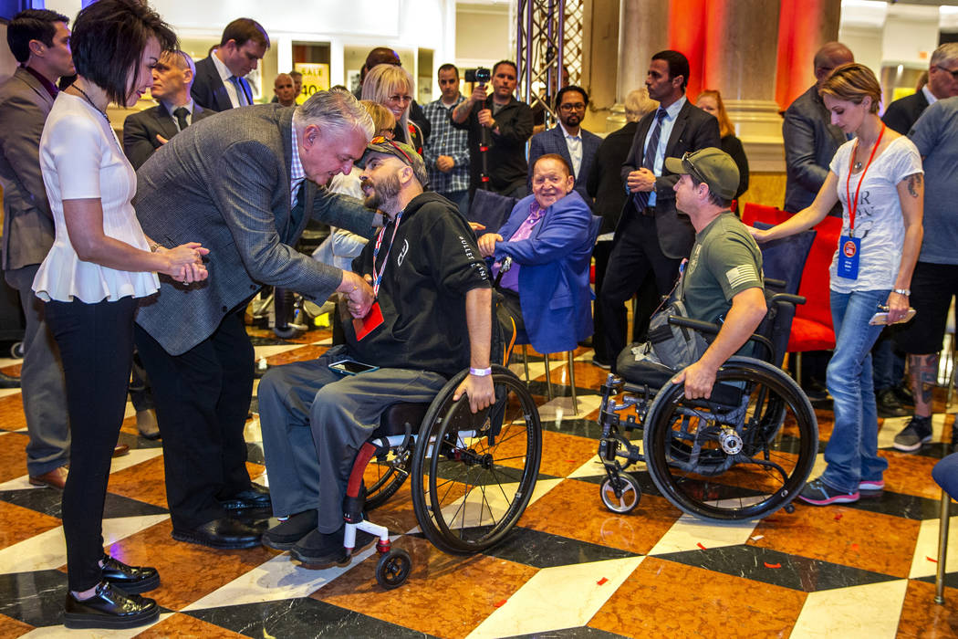 Gov. Steve Sisolak with his wife Kathy with Sheldon and Miriam Adelson thank wounded veterans a ...