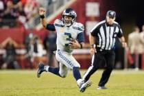 Seattle Seahawks quarterback Russell Wilson (3) runs the ball against the San Francisco 49ers d ...