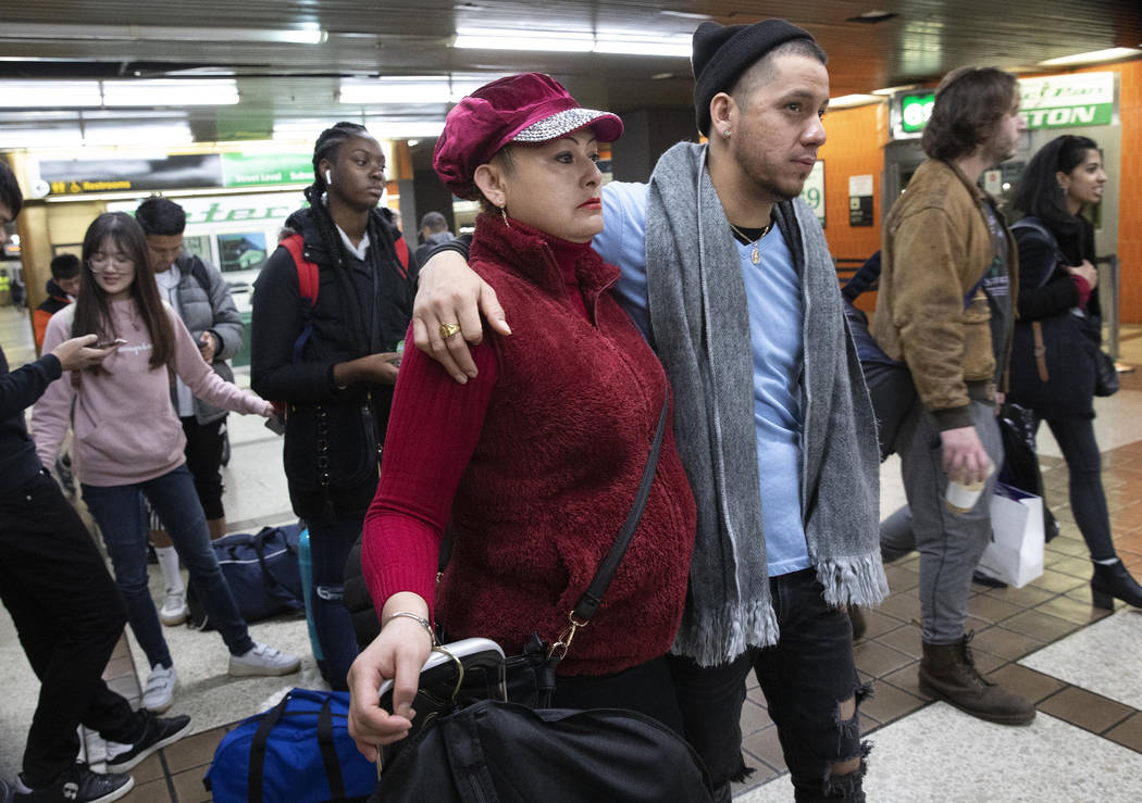 Luz Aurora Vidal and her son, Martín Batalla Vidal, line up to take a bus to Washington, M ...