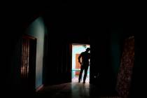 In this Aug. 23, 2019, photo, a Honduran father stands at his home in Comayagua, Honduras, afte ...