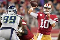 San Francisco 49ers quarterback Jimmy Garoppolo (10) passes against Seattle Seahawks defensive ...