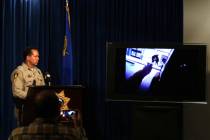 Las Vegas Metropolitan Police Department Assistant Sheriff Tom Roberts watches footage from a b ...