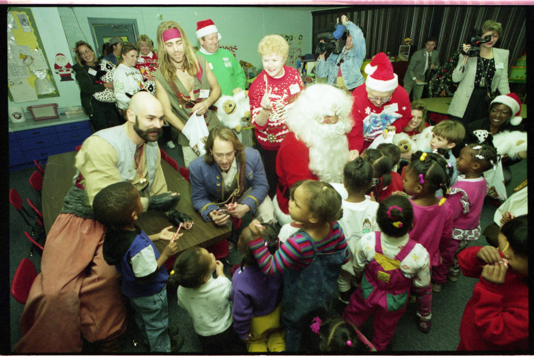 Santa Claus, Mrs. Claus and pirates from Treasure Island show deliver about 200 stuffed animals ...