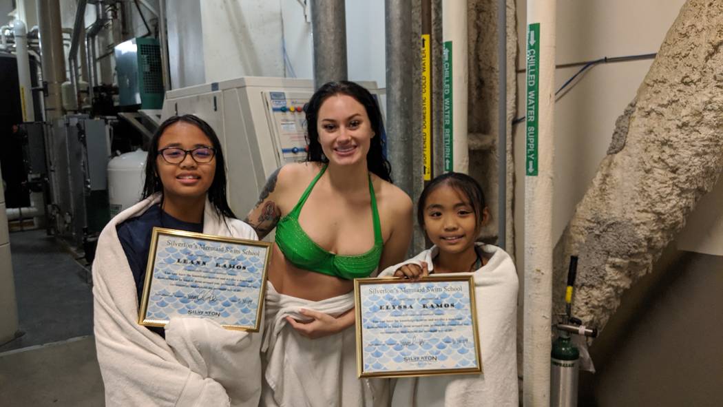 Leann Ramos, 12, from left, Elyssa Ramos, 9, and mermaid Logan Halverson are seen Nov. 9 at the ...
