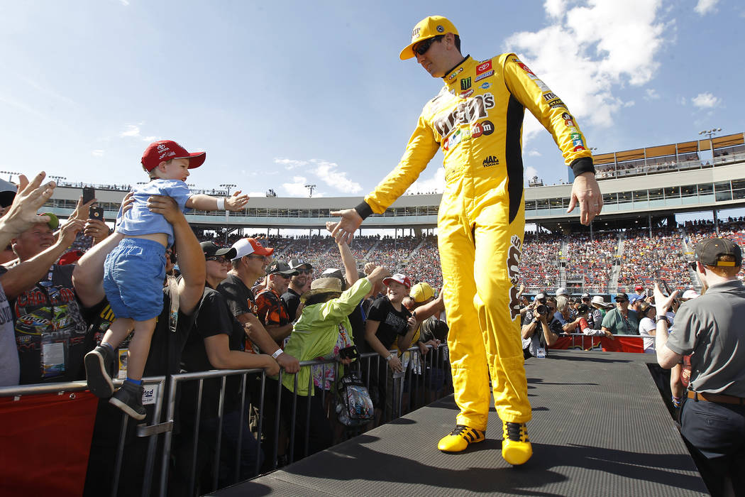 Kyle Busch greets fans during driver introductions prior to the NASCAR Cup Series auto race at ...