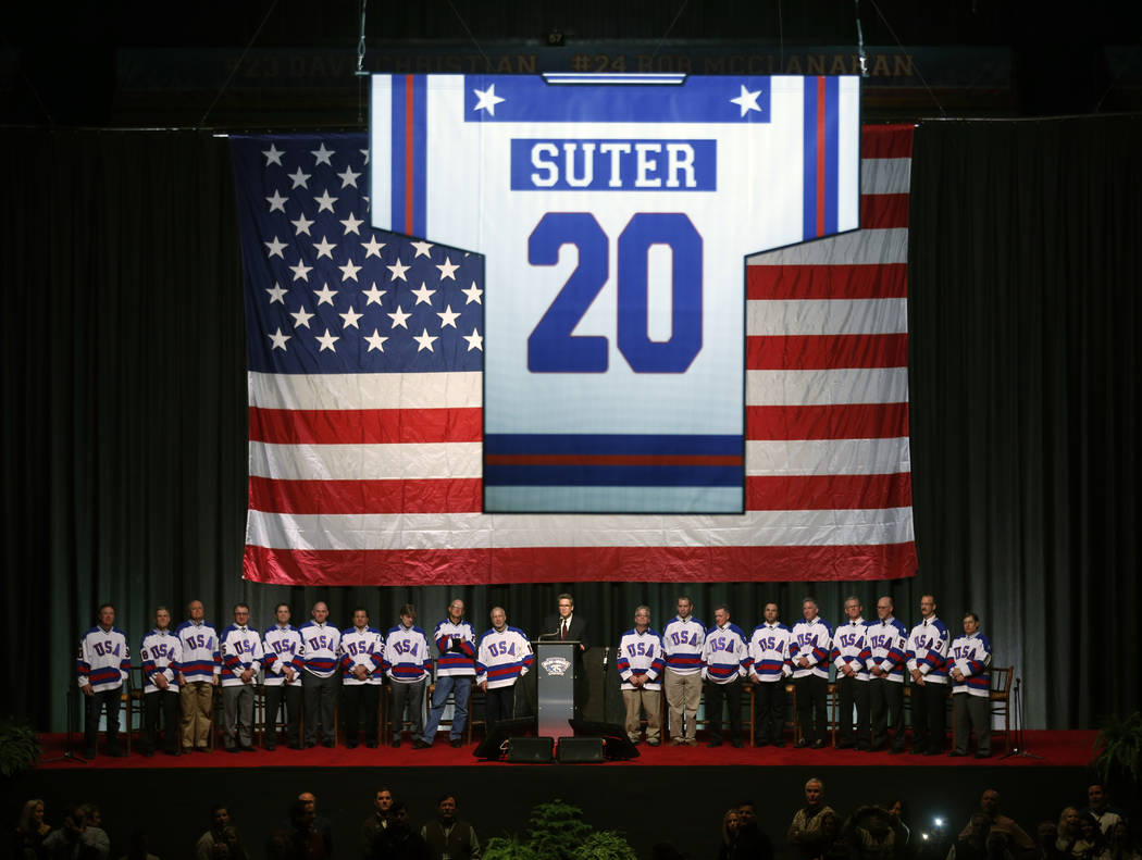 Surviving members of the 1980 U.S. ice hockey team watch as the number of deceased teammate Bob ...