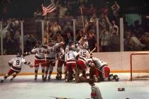 The U.S. hockey team pounces on goalie Jim Craig after a 4-3 victory against the Soviets in the ...