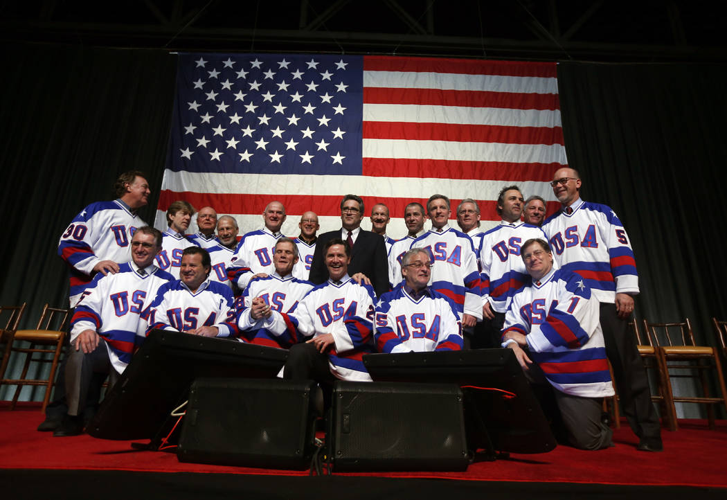 Members of the 1980 U.S. ice hockey team pose for photos after a "Relive the Miracle" ...