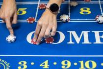 Jelena Dobras practices dealing craps at the CEG Dealer School in Las Vegas, Wednesday, Oct. 30 ...