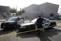 Los Angeles Sheriffs officers and school police guard the campus of Esteban Torres High School ...